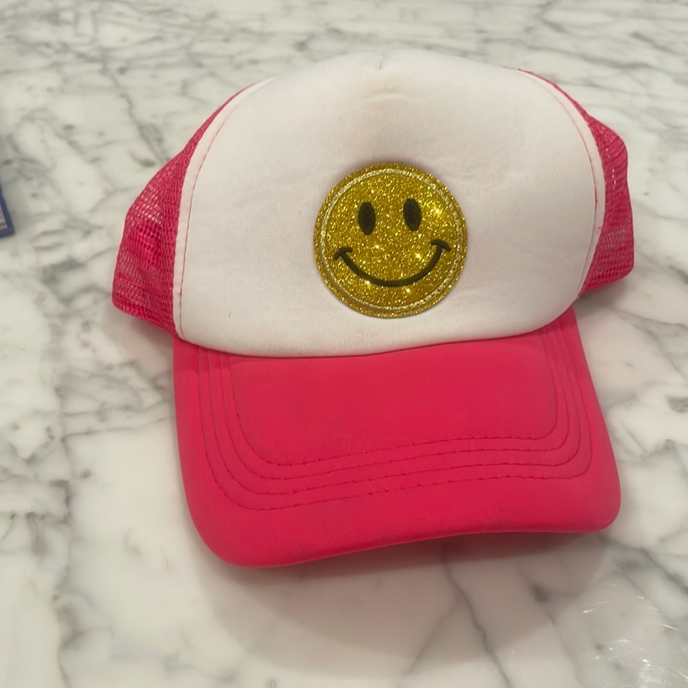Smily face, trucker hat, pink.